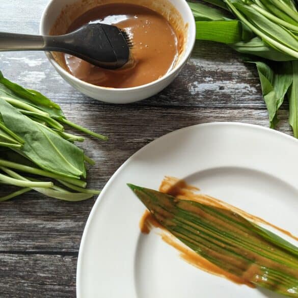 coating wild garlic leaves in homemade hoisin sauce